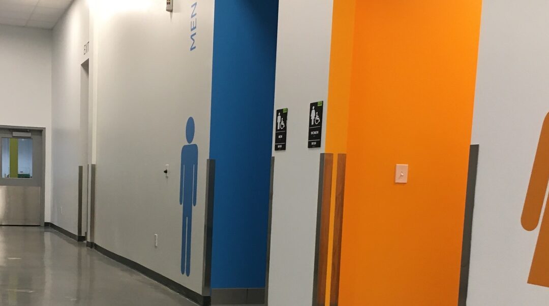 Polished Concrete vs Epoxy Broadcast Flooring: Choosing the Right Option for Restrooms